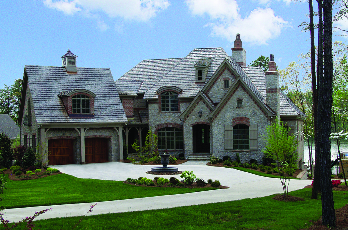 Photo of this luxury manor with European architectural accents. (ThePlanCollection: House Plan #180-1025)