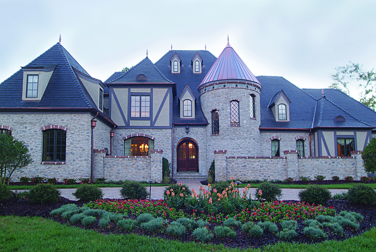 Color photograph of Luxury home plan (ThePlanCollection: House Plan #180-1034)
