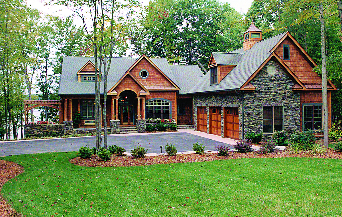 Front elevation of Craftsman home (ThePlanCollection: House Plan #180-1047)