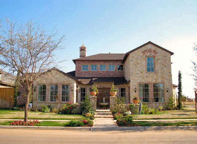 Front elevation of Tuscan home (ThePlanCollection: House Plan #195-1135)