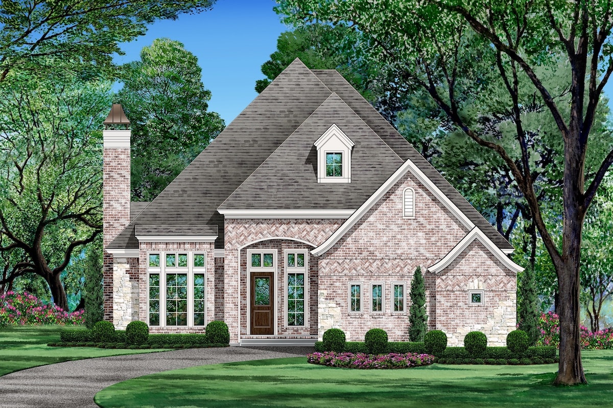 Front elevation of Tudor home (ThePlanCollection: House Plan #195-1206)