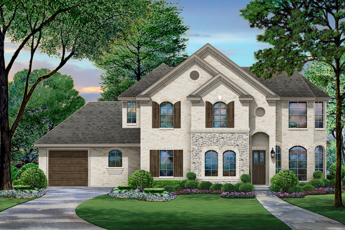 Front elevation of Tudor home (ThePlanCollection: House Plan #195-1209)