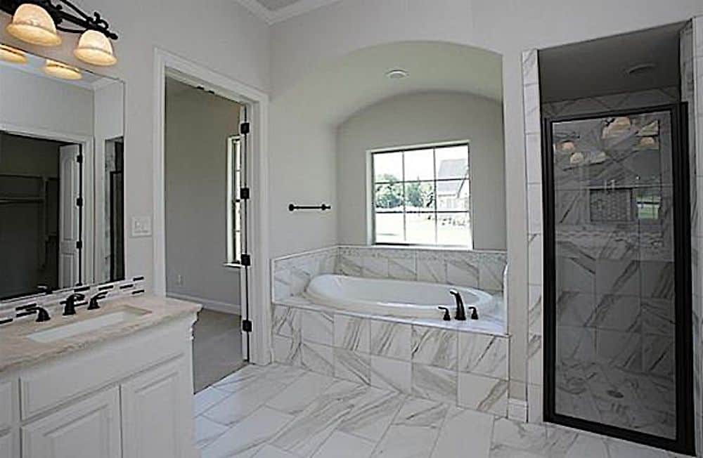 Master Bathroom: Tub of this 4-Bedroom,3164 Sq Ft Plan -195-1284