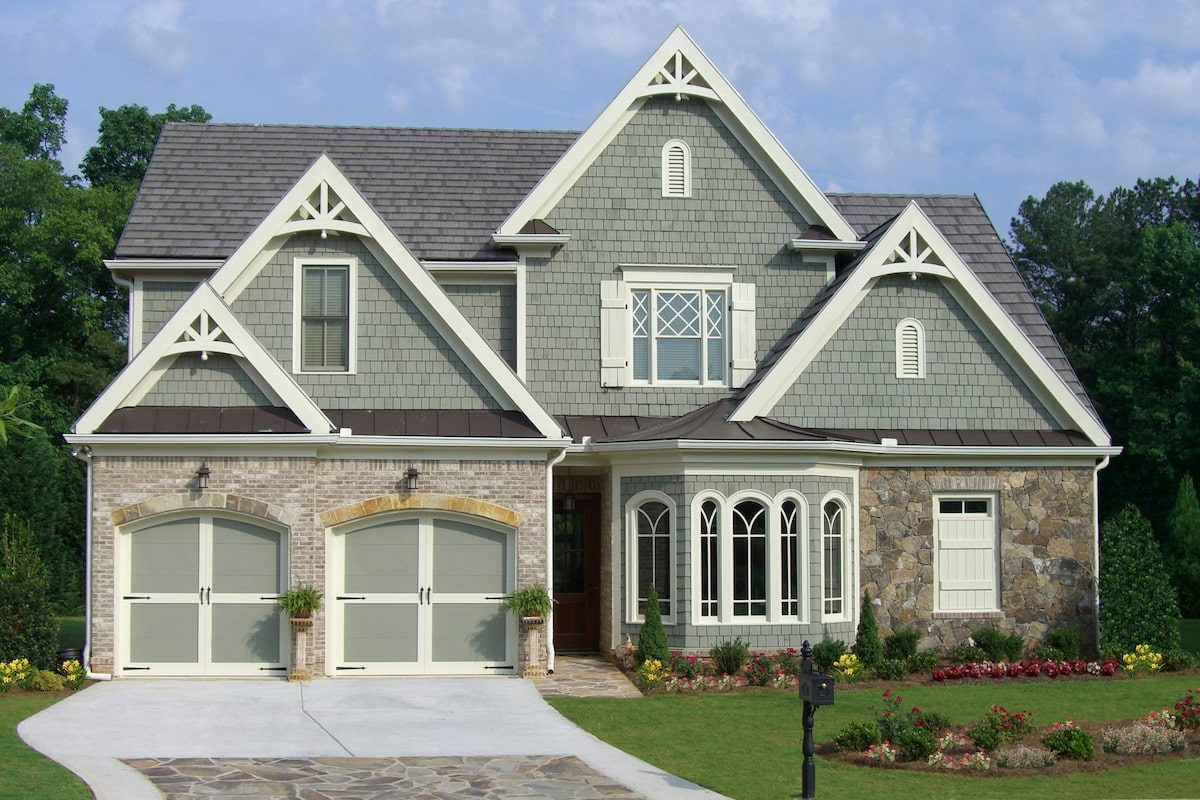 Front elevation of French home (ThePlanCollection: House Plan #198-1065)
