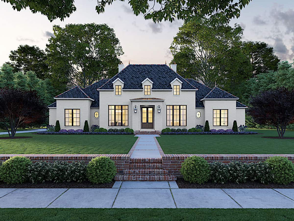 Front elevation of French country home (ThePlanCollection: House Plan #206-1009)