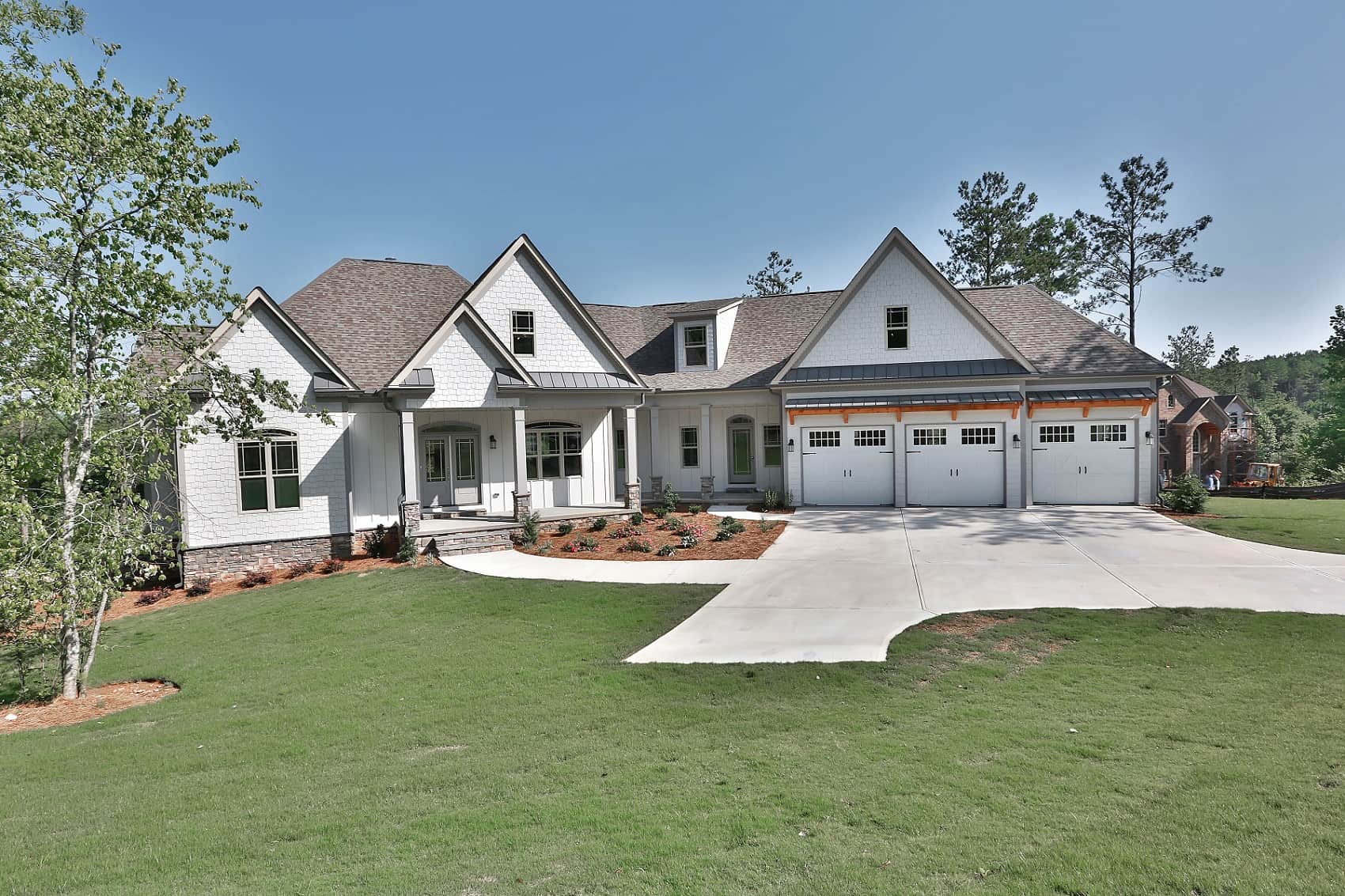 Front elevation of Craftsman home (ThePlanCollection: House Plan #213-1004)
